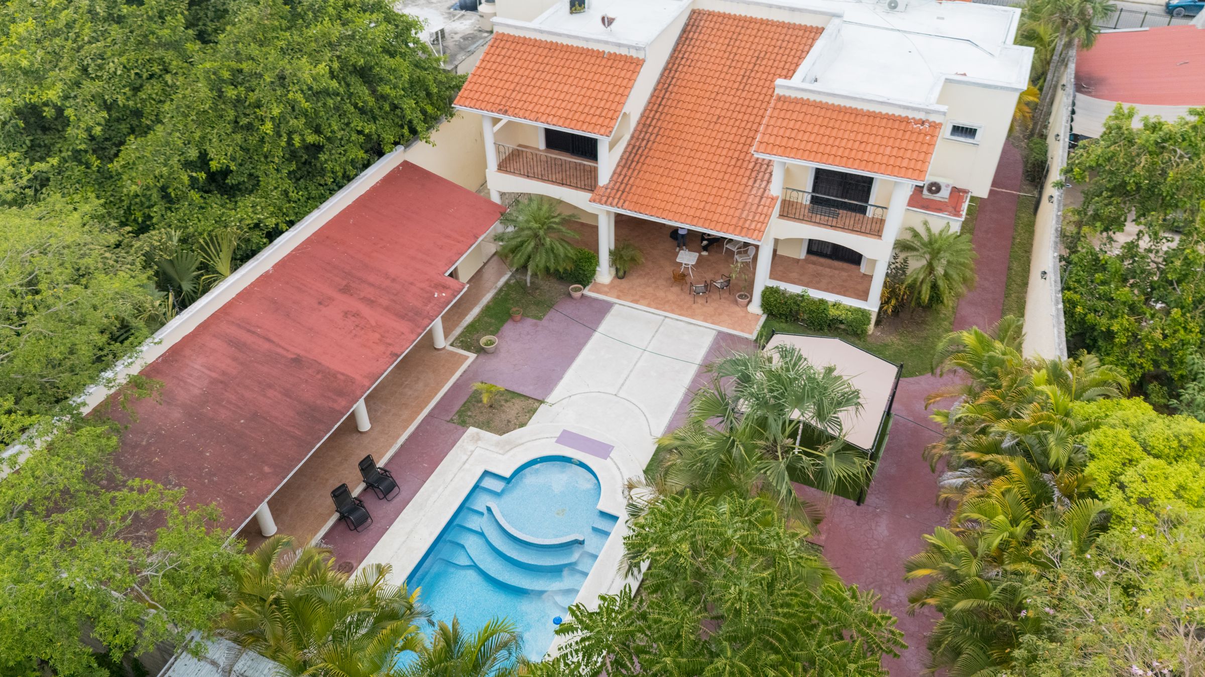 Aerial view of MindScape Retreat's private estate and pool in Cozumel